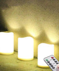 Outdoor IP44 Flameless LED Pillar Candles Set Of 3 With Remote And Timer, warm white, shown illuminated in dark setting