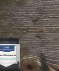 Straight Up Aged Black Reactive Wood Stain Delivers Legit Vintage Aesthetic To Any Wood Project Through Natural Tannin Reactions That Build Deep Warmth With Each Fresh Coat on wood background.