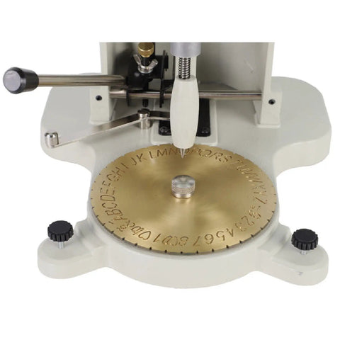 Slick Heavy Duty Ring Inner Engraver Stamper With Adjustable Letter Dial Tool For Jewelers To Stamp Crisp Initials Plus Exact Dates On Any Band Without Breaking A Sweat on a workbench.