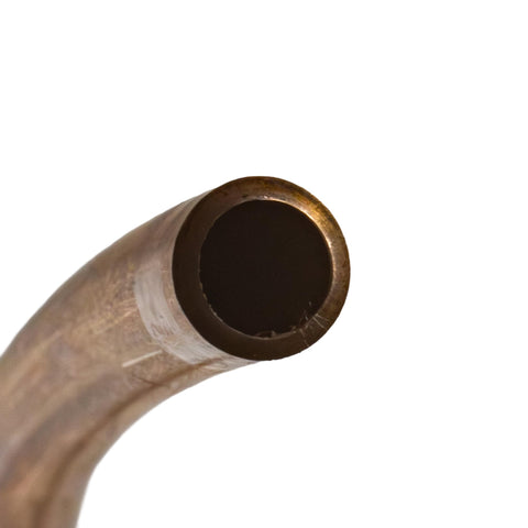 Close-up of copper-nickel brake line tubing end from a curved coil, 3/16 inch diameter.
