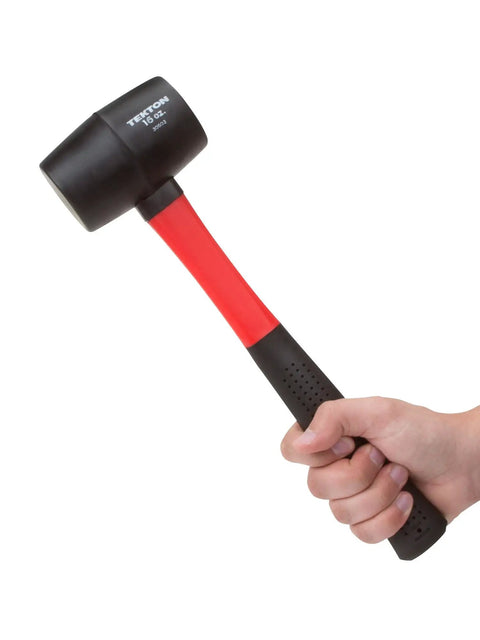 Hand holding 16 Oz Rubber Mallet With Fiberglass Handle Double Faced Solid Head Vibration Dampening Core Poly Jacket Protection