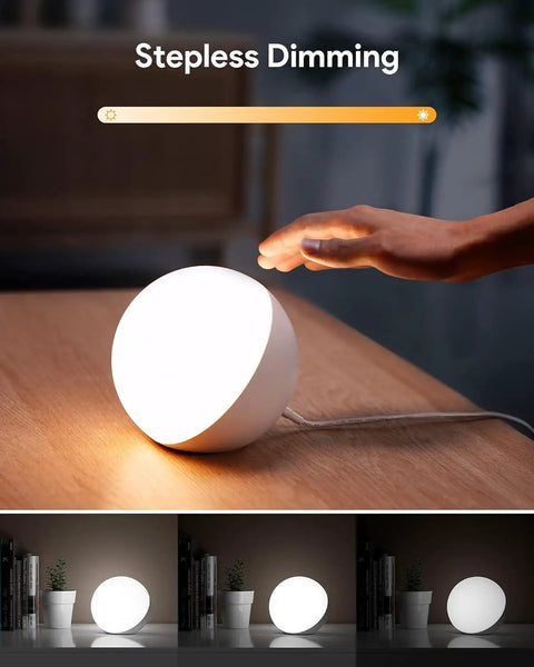 Touch Lamp Multicolor Night Light For Kids being dimmed by hand, illustrating adjustable brightness on nightstand