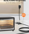 Sturdy 16 AWG power extension cord plugged into wall socket, designed for appliances like toaster ovens.