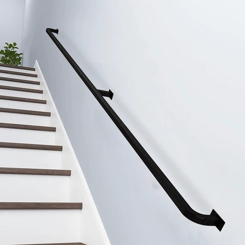 Sick Heavy Duty Black Metal Handrail For Stairs Wall Mounted Banister Rock Solid Wrought Iron Railing on white wall above steps.
