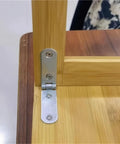 Close-up of a 30 Piece Stainless Steel Folding Hinges 180 Degree Flip Cover Hinge Kit on a wooden cabinet corner