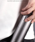 Portable Electric Coffee Burr Grinder With 50g Capacity And Magnetic Cover Aluminum Alloy Body shown being carried in a pocket.