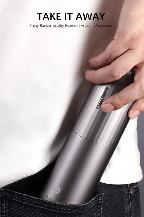 Portable Electric Coffee Burr Grinder With 50g Capacity And Magnetic Cover Aluminum Alloy Body shown being carried in a pocket.