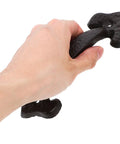 Person holding retro cast iron cabinet handle from set with vintage door pulls for drawers and wardrobes, ergonomic easy grip design.
