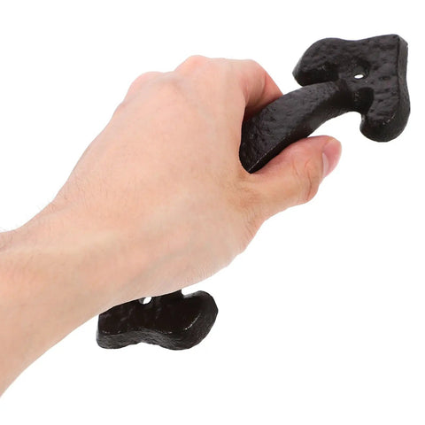 Person holding retro cast iron cabinet handle from set with vintage door pulls for drawers and wardrobes, ergonomic easy grip design.