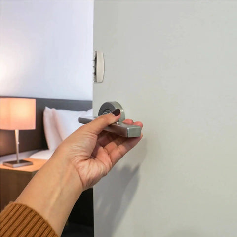 Hand using thumb rotation on Two Set Keyless Push Latch Kit for RV Van Boat Cabinets and Drawers Thumb Rotation Release