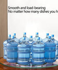 Top Shelf Tempered Glass Lazy Susan Turntable Featuring A Smooth As Butter 360 Degree Swivel Rotation with stacked water bottles.