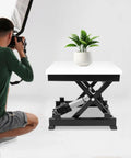 Heavy Duty Electric Scissor Lift Table With No Sweat 130 Lbs Raising Action Smooth Height Adjust From 7 To 16 Inches with a plant