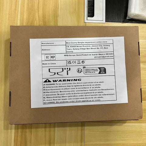 Tough As Nails Coiled Extension Cord With 6 Meter Extra Reach packaging showing manufacturer details and warning instructions.