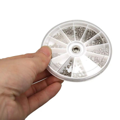 Badass Top Shelf Stainless Steel Eyeglass Screw Repair Kit Hella Tough Cross Flat Head Assortment showing 600 stainless steel screws in a circular case.