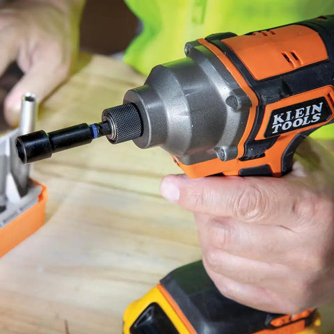 Close-up of hand using 26-Piece Impact Driver Bit Set With Nut Driver And Screwdriver Bits In Durable Case, Extended Reach Pro Bits.