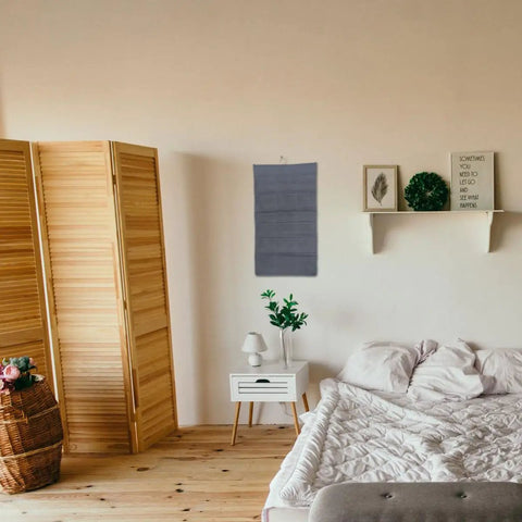 Double Sided Hanging Storage Organizer With Thirty Pockets For Socks Underwear And Clothes Dorm Room Door Wall Mount Space Saving Closet Sorter Game Changer For Tucking Away Clutter Fast Level Up Your Bedroom Setup on a wall in a cozy bedroom.
