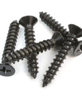 Number 8 By 1 1/2 Inch Phillips Flat Wood Screws With Black Xylan Coated Stainless Steel on white background.