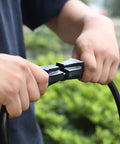 Hands holding Workhorse 25 Foot Outdoor Extension Cord With Power Indicator Light 12 Gauge Three Conductor SJTW.