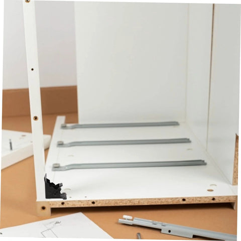 Installed Veemoon folding hinges for tables; two silver metal hinges mounted inside a white cabinet.