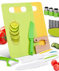 Green kids kitchen tool set with cutting boards, kid-safe knives, peeler, crinkle cutter, and wooden safe knives
