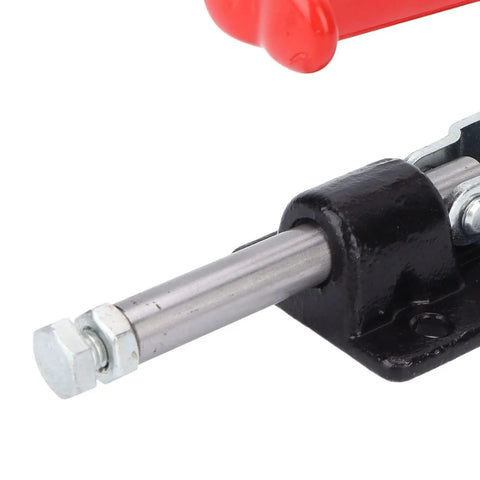 Close-up of Heavy Duty Push Pull Toggle Clamp showing red handle, metal slide, and steel base for secure grip.