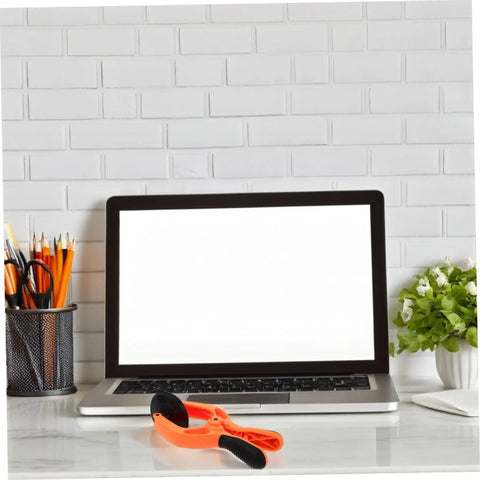 Phone Screen Opening Tool Kit With Suction Cup And Pliers For Quick Repairs on desk next to laptop and pen holder