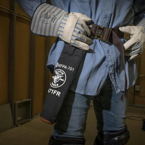 Field tech wearing Flame-Resistant Electrode Bag With Hard Leather Bottom And Belt Loop, Heavy-Duty No 4 Canvas, NFPA 701 Compliant.