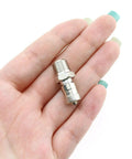 3 Piece Copper Nickel Plated Shock Absorber Valve Kit For 1/8-27 Threads shown in hand for scale