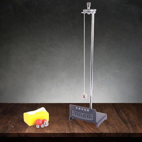 Durable Iron Pendulum Science Kit For Classroom Demonstrations With Ball Base and accessories on a wooden table