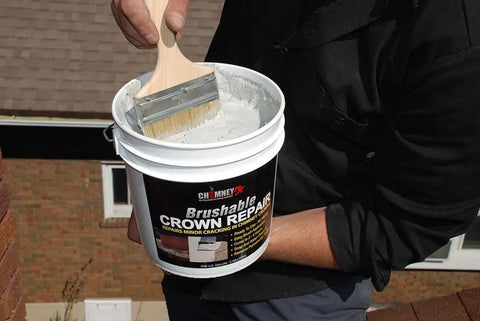 Person applying Brushable Chimney Crown Repair Elastomeric Waterproof Coating For Crowns And Masonry, Fast Setting No Fuss Protection, 1 Gallon