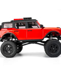 Side view of an RC crawler with Beefed Up 38mm Oil Shock Absorber For AXIAL SCX24 1 24th RC Crawler Upgrade Parts Aluminum Alloy Suspension.