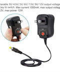 Versatile 12W Universal ACDC Power Adapter with adjustable voltage settings, showing plug and cable connectors.