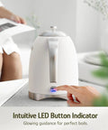 Finger pressing the LED button on a 1.7L Electric Kettle With Stainless Steel Interior, BPA-Free, 1200W Fast Boil, Cordless With Rotational Base, Automatic Shut Off, One-Touch LED, Pearl White.