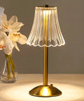 Lit Cordless Table Lamp With USB Rechargeable Battery 12 Inch Brass LED Desk Light With Built In Dimmer next to vase