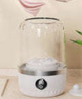 Compact Portable Washing Machine For Travelers And Students Slick Laundry Appliance showing a white washing machine with transparent cover.
