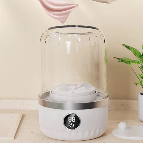 Compact Portable Washing Machine For Travelers And Students Slick Laundry Appliance showing a white washing machine with transparent cover.