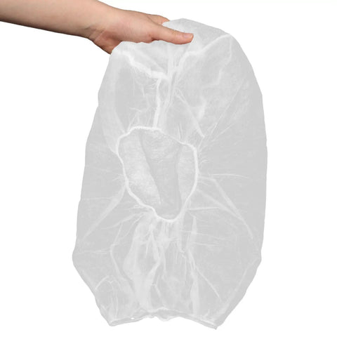 50 Pack White Disposable Nonwoven Space Hood Caps For Snagging Hair Tight, held in hand, showcasing durable head cover design.