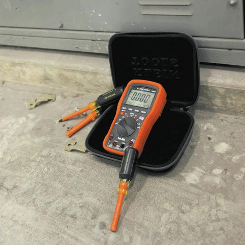 Tradesman Pro Large Hard Case For Meters Tools And Tech Gear with orange meter, rugged hard shell, black, open on concrete surface.