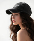 Side view of a woman wearing a breathable men's baseball cap with vented top holes for all day comfort, outdoor hat