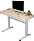 Top Tier Ergonomic Standing Desk With Smooth Crank Lift And Secure Drawer This Height Adjustable Sit Stand Workstation Sets Up A Slick 120x60cm Home Office Vibe That Keeps Your Workspace Tight And Hassle Free All Week with a light wood finish.