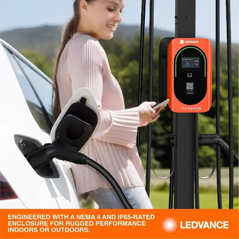 Top Tier Level Two Electric Vehicle Charger Delivers Hella Fast 48 Amp 11point5 Kilowatt Power With A Slick Screen Interface J1772 Connector  in outdoor setting.