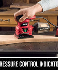 Corded Quarter Sheet Palm Sander With Solid 2 Amp Motor For Smooth Wood Refinishing And Drywall Sanding Fingertip Control Easy Glide Action A Straight Shooter Shop Staple For DIY Work And Fine Finish Tasks in use on a wood surface with pressure control indicator.