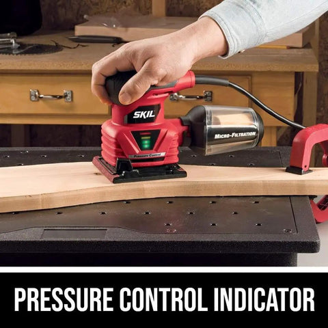 Corded Quarter Sheet Palm Sander With Solid 2 Amp Motor For Smooth Wood Refinishing And Drywall Sanding Fingertip Control Easy Glide Action A Straight Shooter Shop Staple For DIY Work And Fine Finish Tasks in use on a wood surface with pressure control indicator.