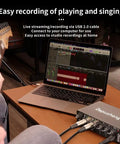 Person playing guitar with Plug And Play USB Audio Interface For Home Studio With Two Mic Preamps, 48V Phantom Power, connected to laptop