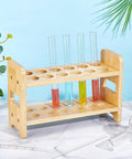 12 Hole Test Tube Rack Made From Bamboo Wood Lab Stand For Chemistry Classrooms And Experiments, Features Interchangeable 26mm 27mm And 28mm Trays For Quick Organization And Sleek Display In The Lab on a decorative table.