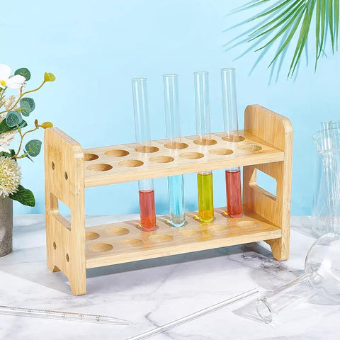 12 Hole Test Tube Rack Made From Bamboo Wood Lab Stand For Chemistry Classrooms And Experiments, Features Interchangeable 26mm 27mm And 28mm Trays For Quick Organization And Sleek Display In The Lab on a decorative table.