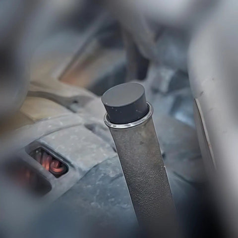 Smoke Machine Cap Plugs Kit 9 Piece Set For Leak Tests No Fuss Rubber Plugs sealing a round automotive pipe opening.