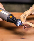 8V Cordless Rotary Tool With Internal Battery, Lightweight And Compact, sanding a wood piece with LED work light on