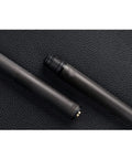 High End Carbon Fiber Pool Cue Shaft With 3/8 Radial Pin And Uni Loc Joint on textured background, showcasing the shaft detail.