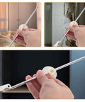 Two Pack Iron Round Disc Cabinet Hinges With Lid Support for kitchen cupboard doors in hand, showing drop-down design.